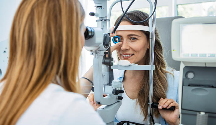 optometrist examining patients eye